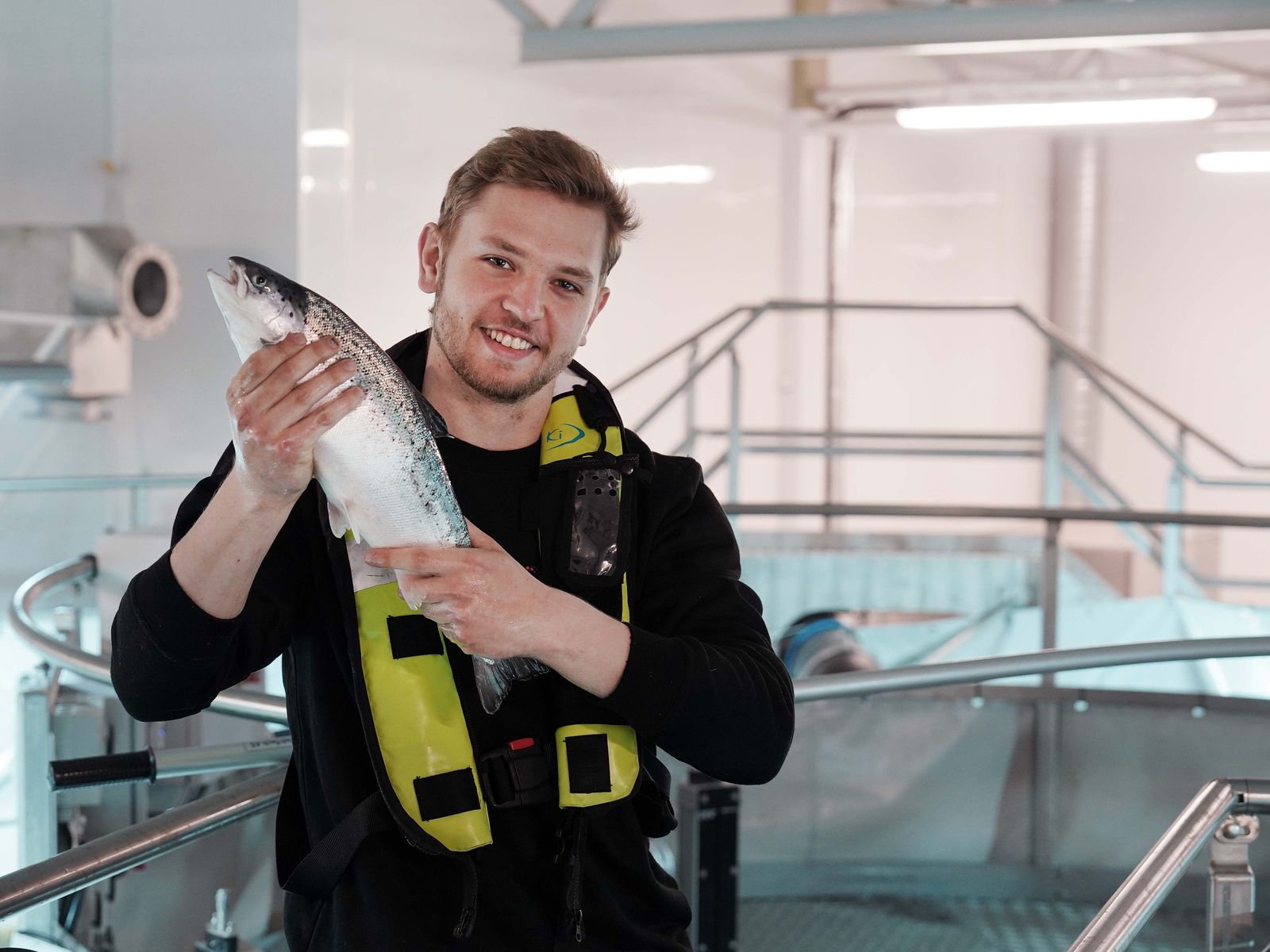 Marius Almenning holds a 2 kg salmon at an Ontec tank