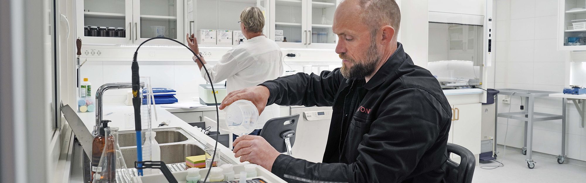 Ontec staff testing water samples in the lab at Måløy